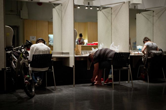 The injection room is filled with booths where mirrors and lights help people inject correctly.