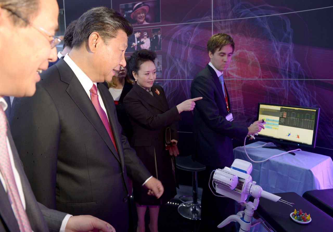 Xi and Peng inspect equipment at Imperial College's Hamlyn Centre for Medical Robotics.