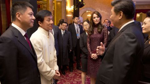 Xi chats with actor Jackie Chan, second left, and Catherine, Duchess of Cambridge, at Lancaster House in London on October 21.