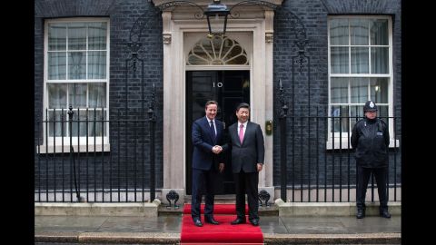 Cameron greets Xi as he arrives at 10 Downing Street on October 21.