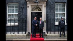 Britain's Prime Minister David Cameron greets Xi as he arrives at 10 Downing Street.