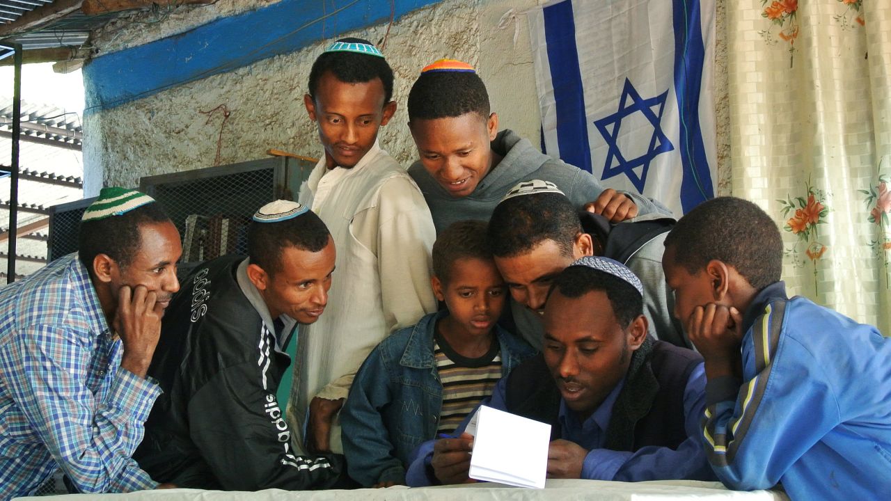 Ethiopian Jews gather at a makeshift synagogue in Gondar, Ethiopia, to see if they have been given a date to move to Israel on November 19, 2012.