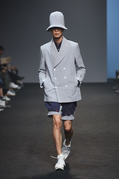 Munsoo Kwon's collections are known for introducing new materials and alternative cuts to the traditional mens tailored suit. This season he also revealed a series of streetwear staples and standout accessories.