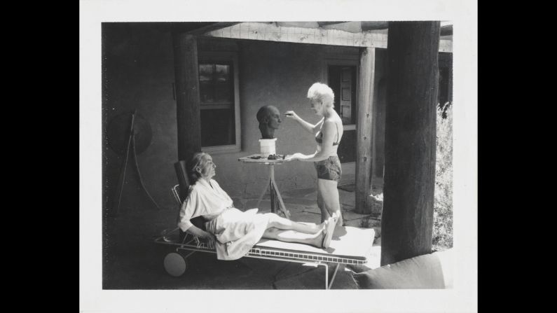 Una Hanbury redefines business casual as she wears a bathing suit while sculpting a bust of fellow artist Georgia O'Keeffe in 1967. Both Hanbury and O'Keeffe maintained art studios in New Mexico. The cast bronze bust is now on display in the Smithsonian's National Portrait Gallery.