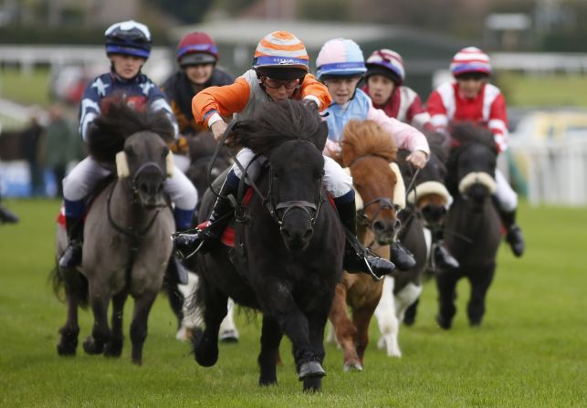 Fourteen-year-old Bradley Kent (in orange sleeves) passed the post first on Bugsey, his second win at the event after heading the pack in 2012.