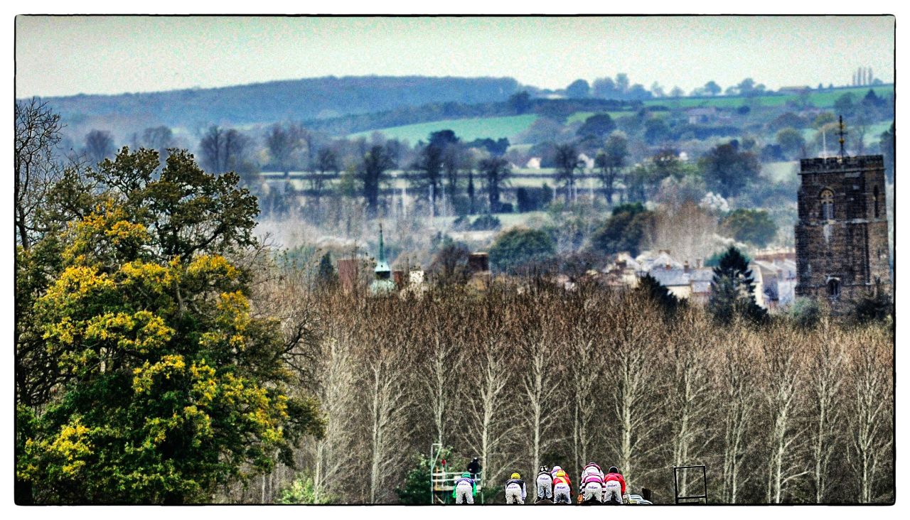 Runners make their way down the side of the track at Towcester racecourse. Towcester is the only British racecourse which offers free racing for most of its fixtures.
