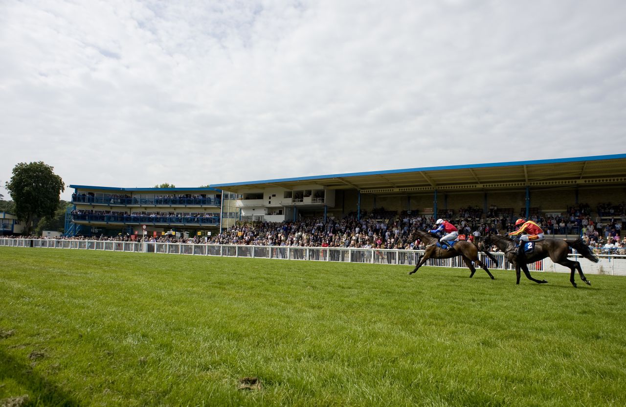 Donal Fahy riding Dark Spirit (left) wins The Green Taveners Juvenile Maiden Hurdle Race at Newton Abbot racecourse in September, 2011. Newton Abbot is now a summer jump course only, with its season starting in March running through to the end of August/early September.
