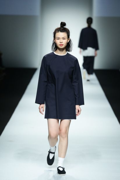 Boundless' opening looks showed a uniform-like vibe, and came paired with traditional Chinese shoes, white socks and bare makeup.