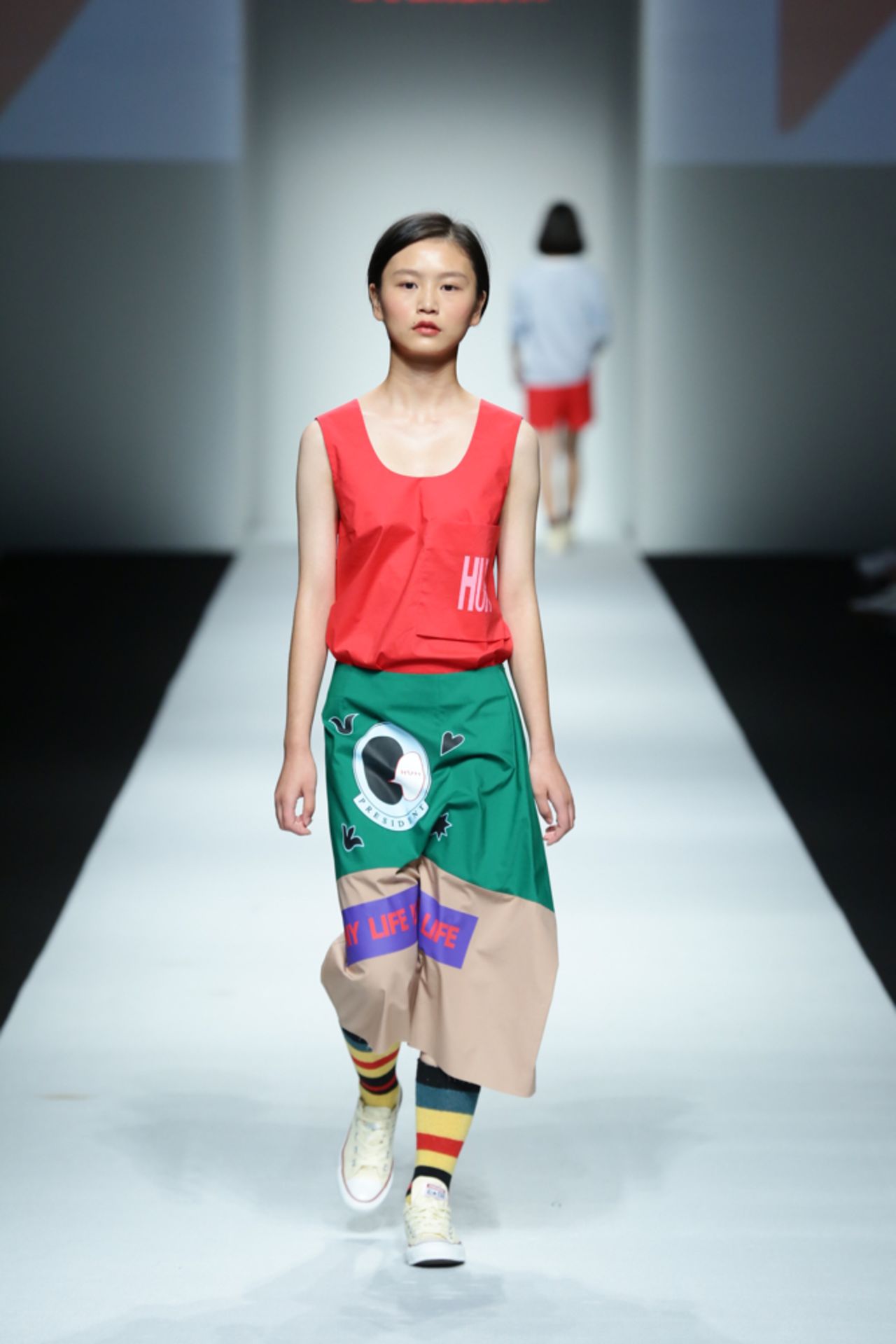 Main highlights from the collection were a series of joyful separates in summery, yet pared down colors -- a gorgeous green, a pale pink -- as well as a series of graphic tees and sweatshirts emblazoned with fun, eye catching prints. 