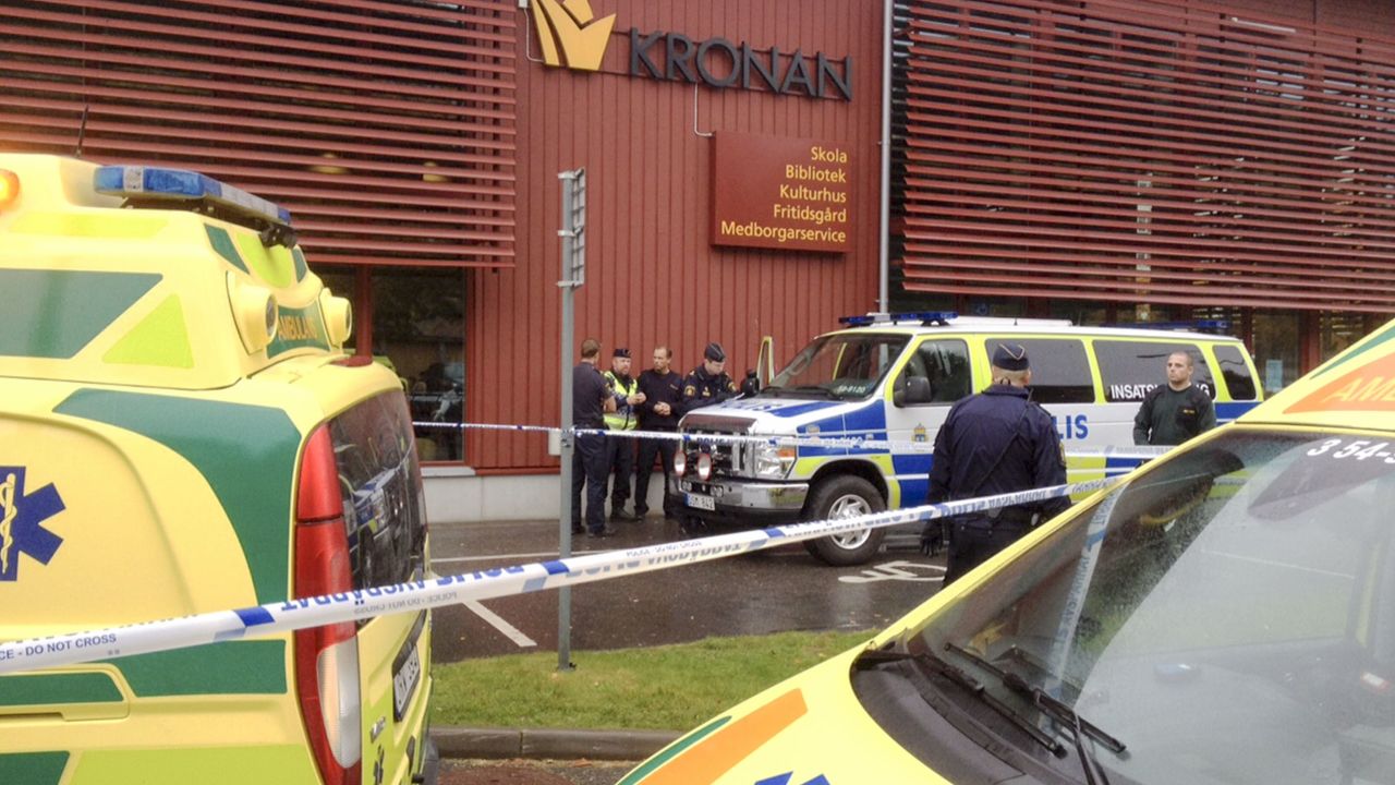 Emergency services attend the scene after a masked man attacked people with a sword, at the Kronan school in Trollhattan, near Goteborg, Sweden, Thursday Oct. 22, 2015. At least six people were injured, and the offender was shot by the police. (Stig Hedstrom/TT via AP) SWEDEN OUT