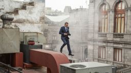 Bond (Daniel Craig) runs along the rooftops in pursuit of Sciarra in Mexico City in Metro-Goldwyn-Mayer Pictures/Columbia Pictures/EON Productions' action adventure SPECTRE.