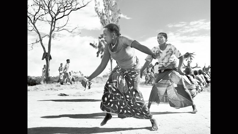 Coffee pickers dance in a Tanzanian village in the town of Mbinga, near Lake Nyasa, in 2014. Before coffee's eventual export, flawed or discolored beans must be removed by hand.