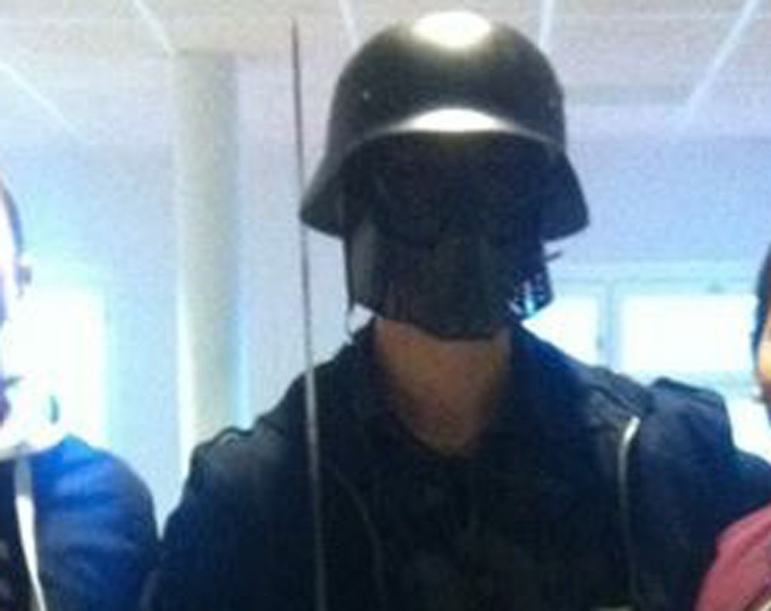 AFP received this photo purportedly showing a masked man with students. 