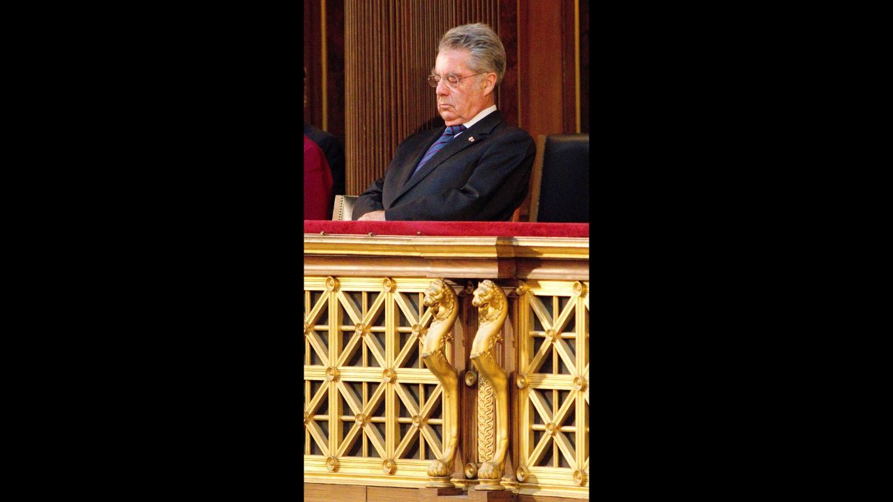 Austrian President Heinz Fischer conserves his energy during a commemoration ceremony against violence and racism in Parliament in May 2012.