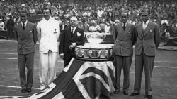 The British team with the trophy on the Centre Court at Wimbledon after retaining the Davis Cup, London, 28th July 1936. Left to right: Bunny Austin (1906 - 2000), Fred Perry (1909 - 1995), Raymond Tuckey (1910 - 2005) and Pat Hughes (1902 - 1997). (Photo by A. Hudson/Topical Press Agency/Hulton Archive/Getty Images)