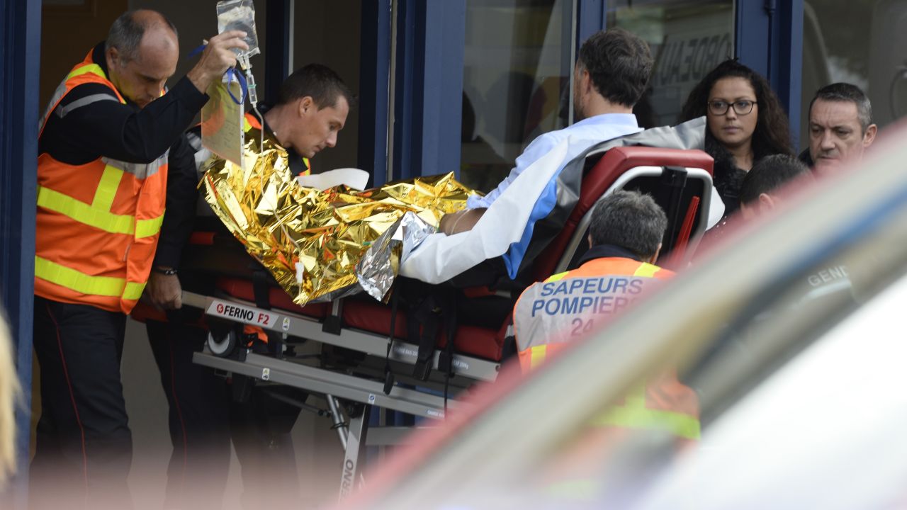 Firemen carry on a stretcher a man injured in a coach accident  on October 23, 2015 in Puisseguin, near Libourne, southwestern France. At least 42 people, most of them elderly, were killed when a coach collided with a lorry and caught fire in southwest France on October 23 in the country's worst road accident for three decades, officials said. AFP PHOTO /JEAN-PIERRE MULLER        (Photo credit should read JEAN-PIERRE MULLER/AFP/Getty Images)