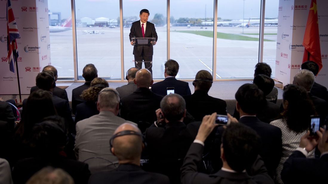 Chinese President Xi Jinping addresses an audience of dignitaries, including British Prime Minister David Cameron, at the Manchester airport in Manchester, England, on Friday, October 23. It was the end of a four-day state visit for Xi, who traveled to the United Kingdom with his wife, Peng Liyuan.