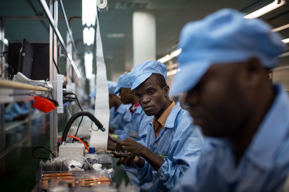 In 2012, economic activity related to mobile phones and their life-cycle accounted for about 3.3 million jobs.<br /> <br />Pictured:  Employees work on mobile phones on the assembly line at the VMK (for "Vumbuka", "Wake up" in Kituba) factory in Brazzaville on July 20, 2015. The factory, run by Verone Mankou, produces the first mobile phones made in French speaking Africa. 