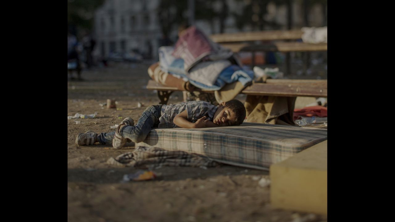 Abdullah, 5, sleeps outside a railway station in Belgrade, Serbia. He saw the killing of his sister in their home in Daraa, Syria. He is still in shock and has nightmares every night, his mother says. Abdullah is tired and has a blood disease, but his mother does not have any money to buy medicine for him.