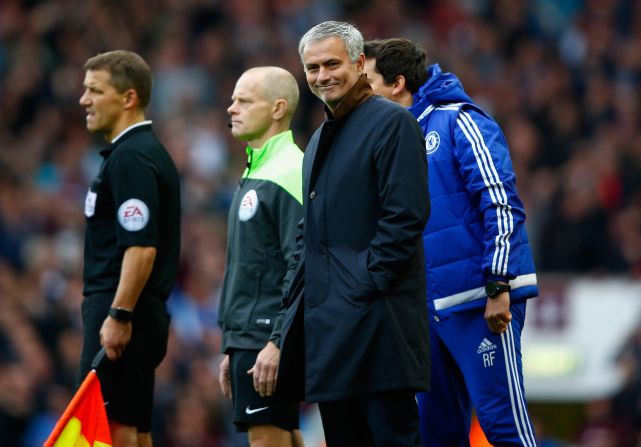 Mourinho gives an ironic smile as the decisions went against him and his side at West Ham. 