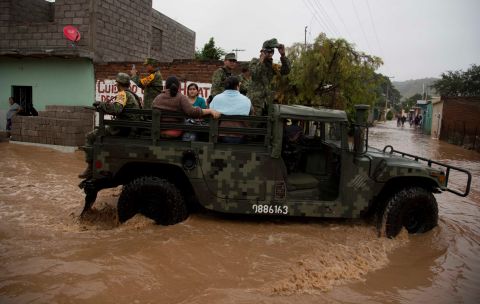 Soldiers evacuate residents to a shelter in Zoatlan on October 24. 