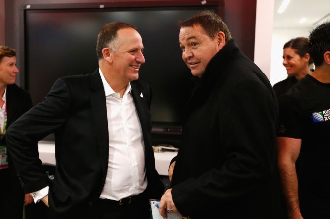 All Blacks coach Steve Hansen (right) and New Zealand Prime Minister John Key chat in the dressing room after the semifinal against South Africa.