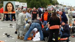 Emergency personnel and spectators respond after a vehicle crashed into a crowd of spectators during the Oklahoma State University homecoming parade, causing multiple injuries, on Saturday, Oct. 24, 2015 in Stillwater, Oka. (David Bitton/The News Press via AP) MANDATORY CREDIT