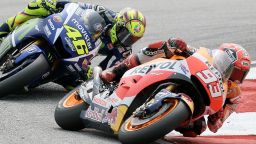 Marc Marquez and Valentino Rossi (No 46) get up close and personal as they battle at the Malaysian MotoGP at Sepang. 