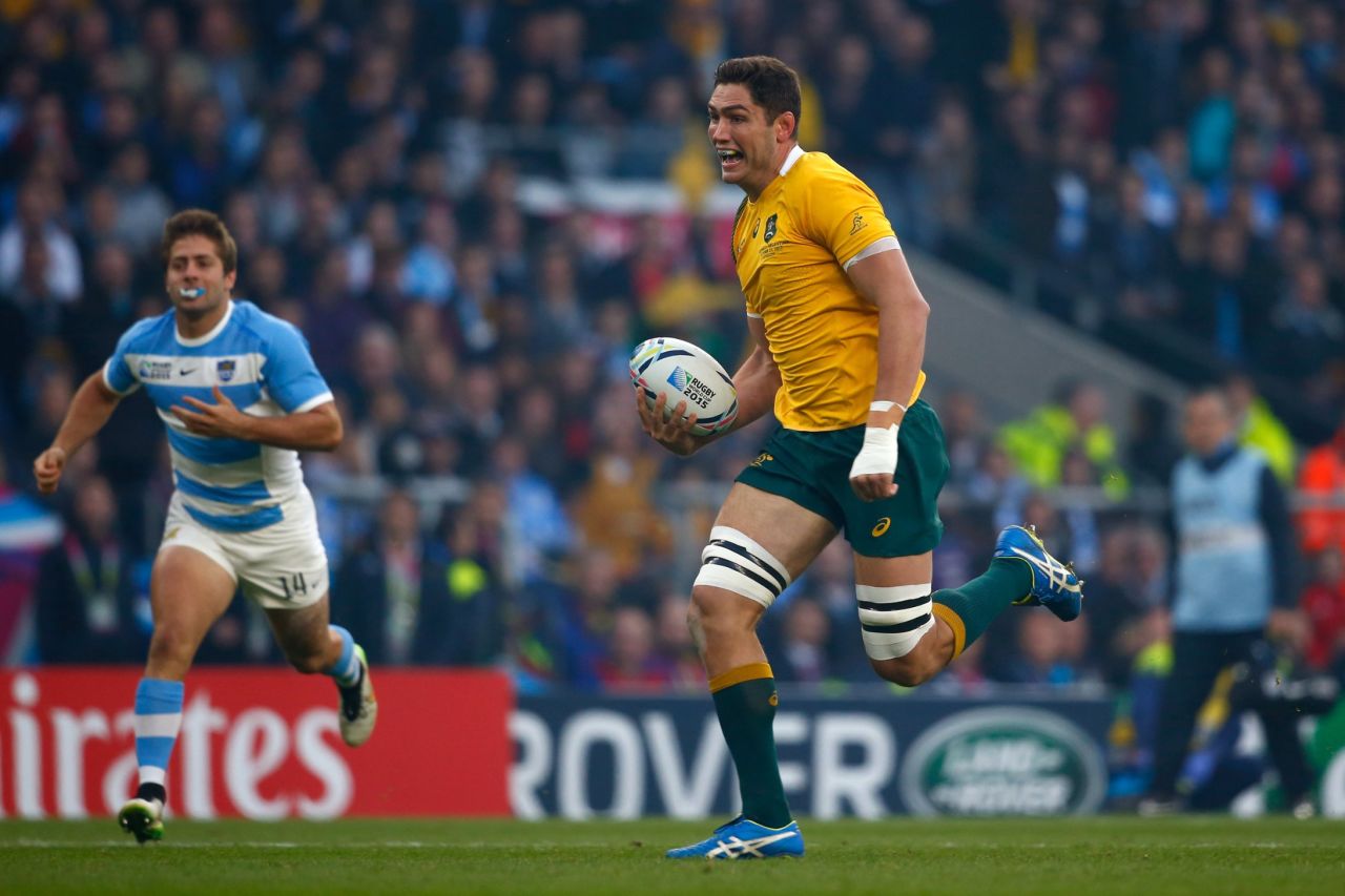Rob Simmons of Australia races through to score the opening try of the World Cup semifinal against Argentina with just a few seconds on the clock. 