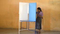 An indigenous woman casts her vote at the Chinautla municipality, 15 km north of Guatemala city,  during Guatemala's run-off election on October 25, 2015. Guatemalans began casting ballots in a presidential run-off Sunday, choosing between a comedian with no political experience and a former first lady, amid the fallout of a massive corruption scandal. AFP PHOTO/ JOHAN ORDONEZ        (Photo credit should read JOHAN ORDONEZ/AFP/Getty Images)