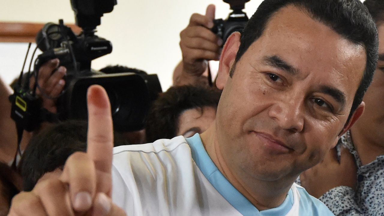 Guatemalan presidential candidate for the National Front Convergence Jimmy Morales shows his inked finger after casting his vote in Mixco, near Guatemala City on October 25, 2015. Guatemalans vote in a presidential run-off choosing between a comedian with no political experience and a former first lady, amid the fallout of a massive corruption scandal. AFP PHOTO / RODRIGO ARANGUA        (Photo credit should read RODRIGO ARANGUA/AFP/Getty Images)