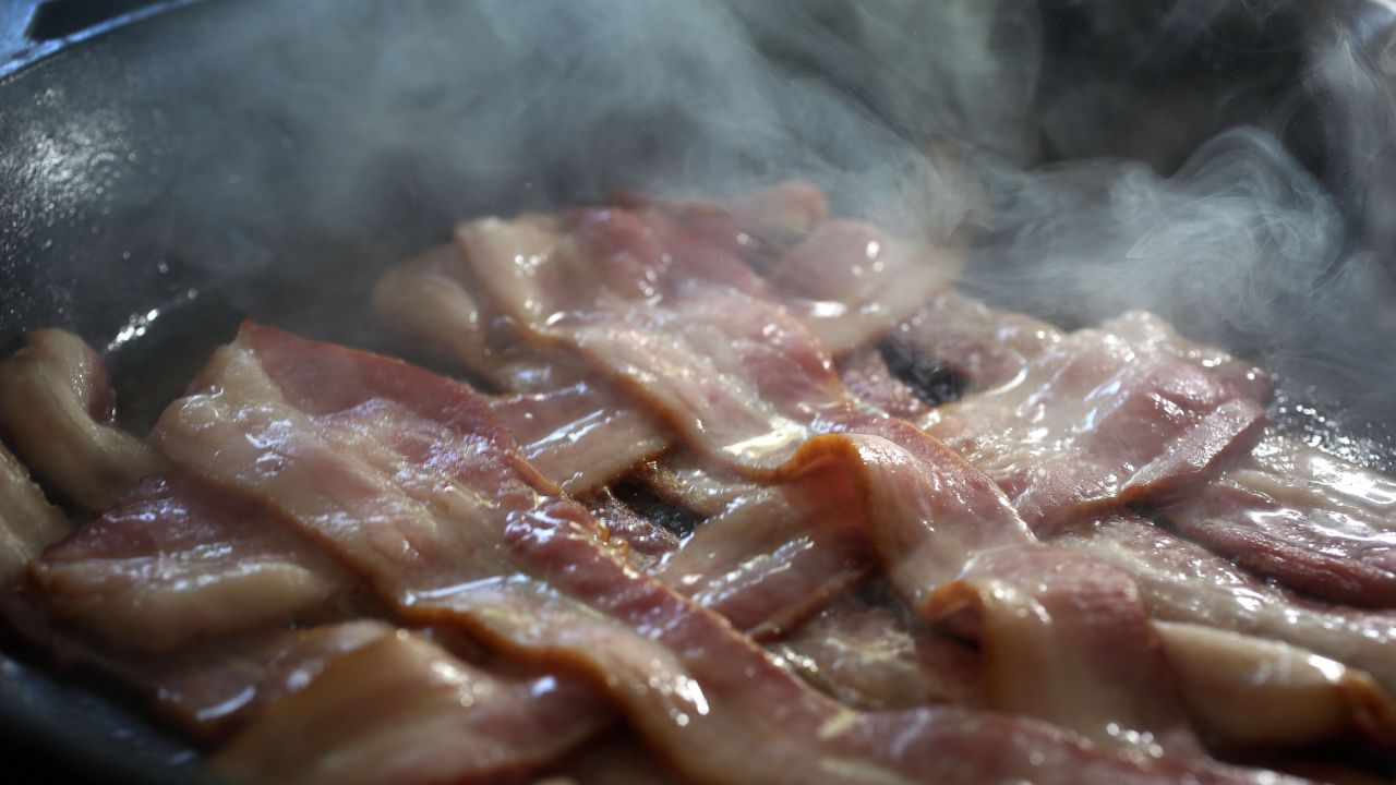 MIAMI, FL - OCTOBER 26:  In this photo illustration, bacon cooks in a frying pan on October 26, 2015 in Miami, Florida. A report released today by the World Health Organisation's  International Agency for Research on Cancer announced that eating processed meat can lead to colorectal cancer in humans even as it remains a small chance but rises with the amount consumed.  (Photo illustration by Joe Raedle/Getty Images)