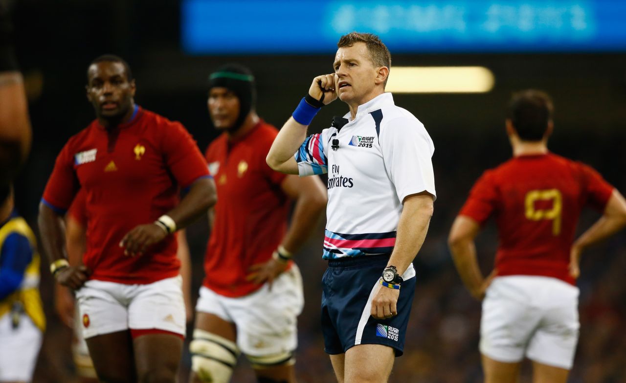 Rugby referees can use the television match official (TMO) to help them make decisions during matches. Here, Owens listens to the TMO during the World Cup quarterfinal match between New Zealand and France at the Millennium Stadium.