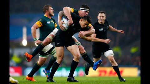 Francois Louw of South Africa leaps on to the back of Sonny Bill Williams of New Zealand during the 2015 Rugby World Cup Semi Final match at Twickenham Stadium in London on Saturday, October 24.
