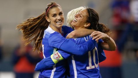 Carli Lloyd, right, celebrates with Alex Morgan after scoring a goal against Brazil in the second half of the game on Wednesday, October 21, in Seattle.