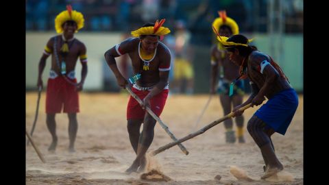 Brazilian men practice sports activities during a cultural event at the World Indigenous Games on Saturday, October 24, in Palmas, Brazil. 