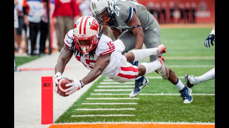 Wisconsin wide receiver Robert Wheelwright dives into the end zone for a touchdown during the second quarter of an NCAA college football game against Illinois on Saturday, October 24, in Champaign, Illinois. 