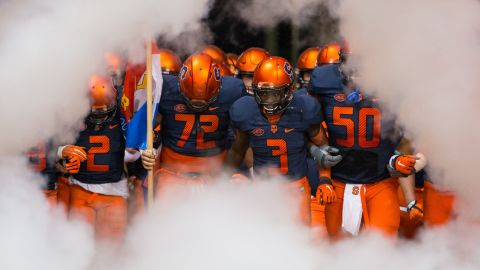 Syracuse University football players run on the field on Saturday, October 24, before the game against the University of Pittsburgh. The Pittsburgh Panthers won 23-20. <a href="http://www.cnn.com/2015/10/20/sport/gallery/what-a-shot-sports-1020/index.html" target="_blank">See 44 amazing sports photos from last week</a>