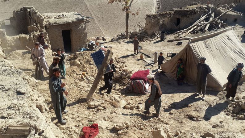 Men carry their belongings in Afghanistan's Takhar province, north of Kabul.