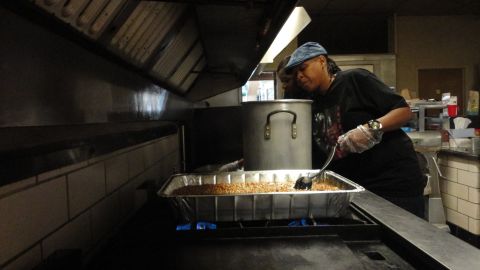 Pamela Burrell prepares food for women and children in need.