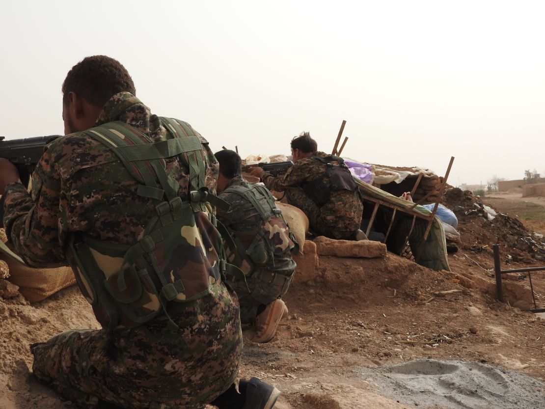 Kurdish YPG fighters fighting on the front line against ISIS.