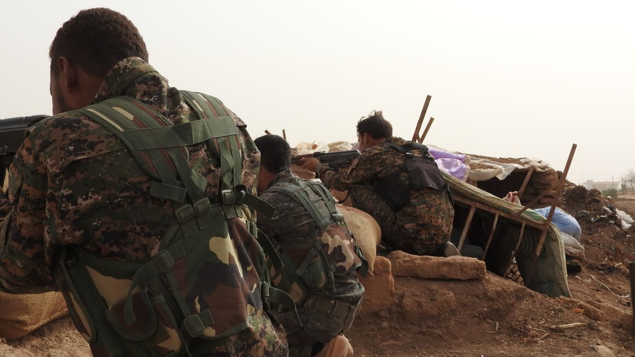 Kurdish YPG fighters fighting on the front line against ISIS.