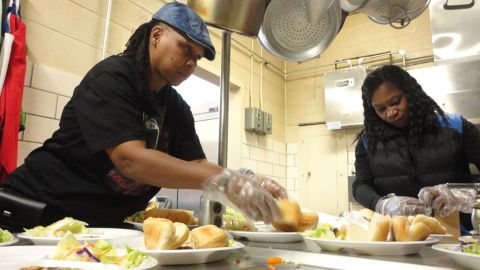 Pamela Burrell puts together meals for women and children in need.