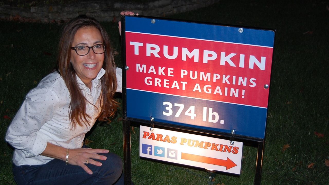 Jeanette Paras and the sign for her 2015 Trumpkin creation