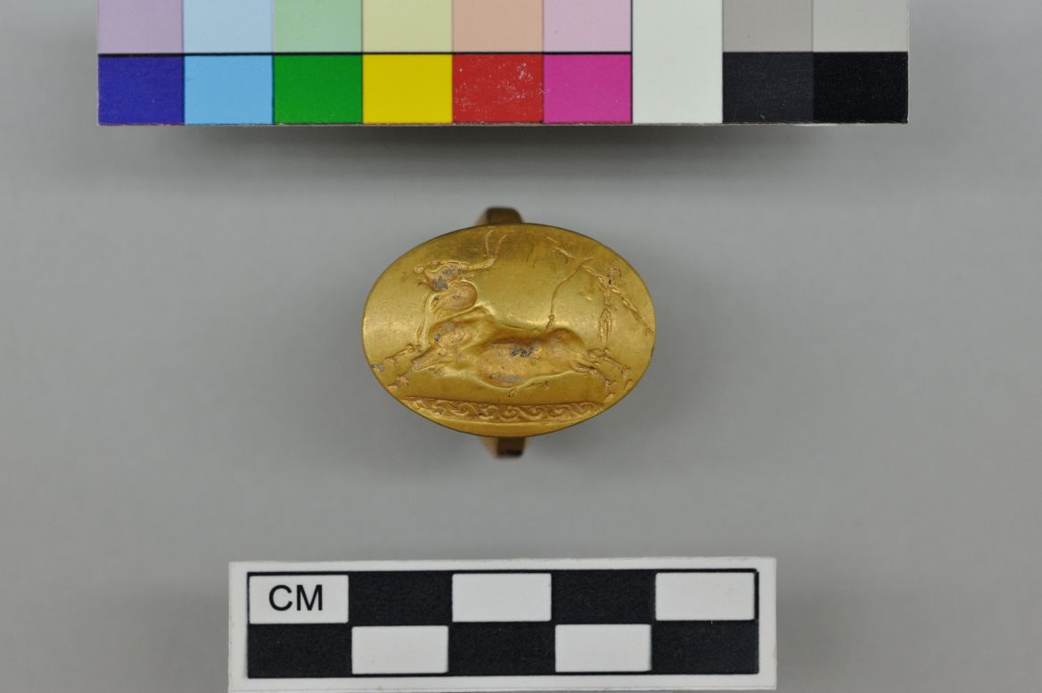 Four solid-gold rings were found in the tomb -- more than have been found at any single burial site elsewhere in Greece, according to the archaeologists. This one depicts a Cretan bull running scene.