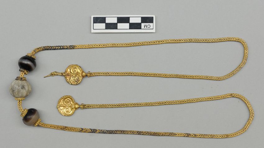 This unique necklace measures more than 30-inches long and features two gold pendants decorated with ivy leaves. It was found near the neck of the warrior's skeleton.