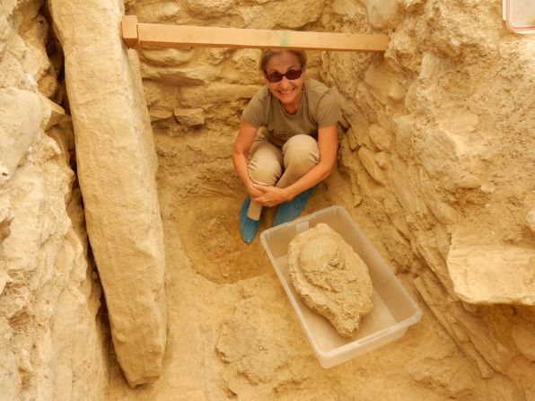 Sharon Stocker with the 3,500 year-old skull found in the warrior-king's tomb. "We have no idea of the identity of this man," she said, other than he was important and rich. "We are looking at a period in Greece where people where usually buried with ceramic objects but this man was so rich that there were no ceramics. He was buried with bronze, silver and gold."