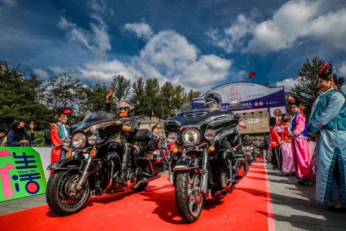 A motorcycle brigade kicks off the classic car rally, which began at the Great Wall in Beijing. 