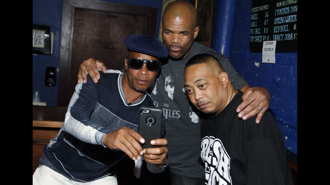 Brother Marquis, left, and Fresh Kid Ice, right, of 2 Live Crew pose for a selfie with Darryl "DMC" McDaniels of Run DMC backstage at Rock The Vote's #TBT 25th Anniversary Concert in Washington on Thursday, October 22.