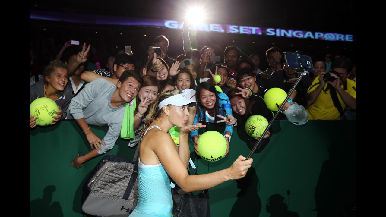 Maria Sharapova of Russia poses for a selfie after a three-set victory againt Poland's Agnieszka Radwanska in a round-robin match during the BNP Paribas WTA Finals in Singapore on Sunday, October 25.
